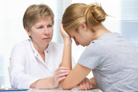 lady talking to a counsellor/practitioner